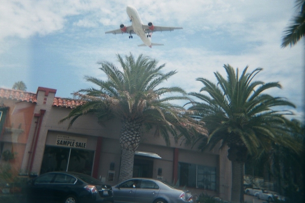 Airplane landing over Little Italy
